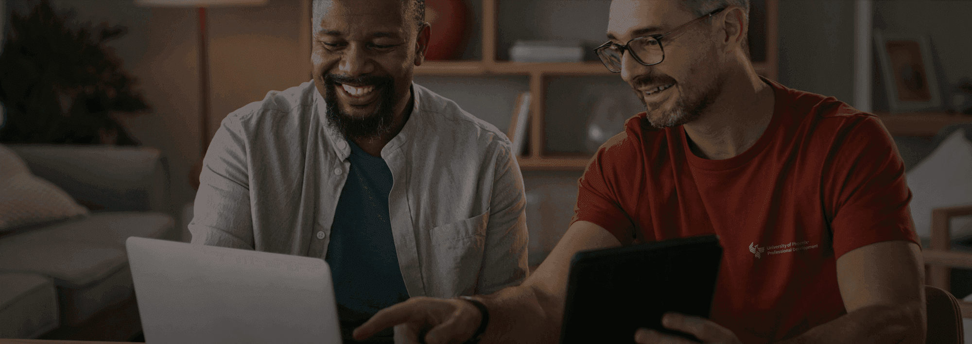 two men looking at laptop